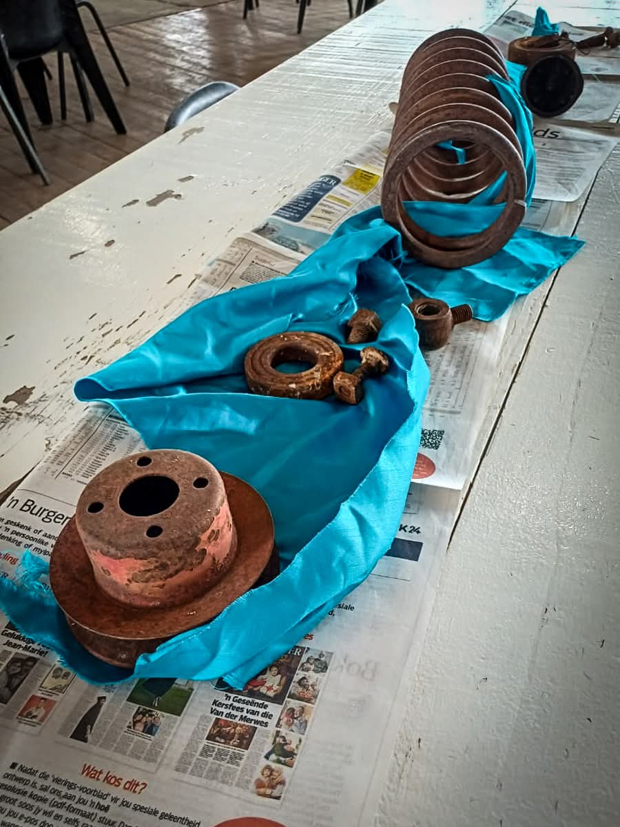 Tables decorated with rusty car parts